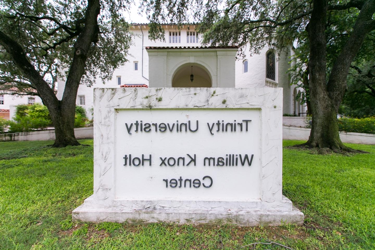 Large marble sign reads "Trinity University William Knox Holt Center"